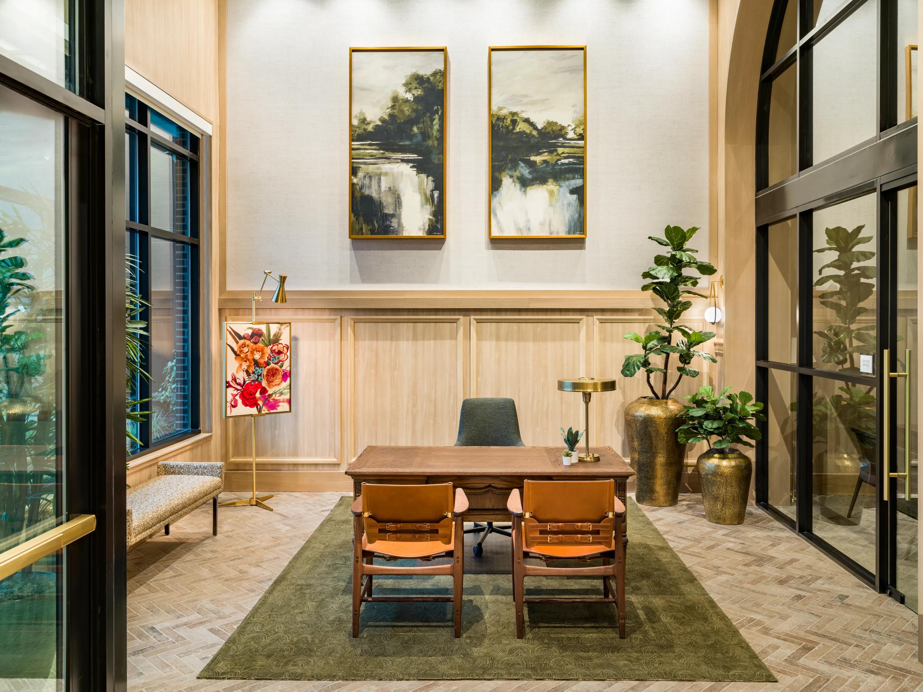 lobby with two story ceilings and large glass windows at modera university park apartment homes for rent in denver co