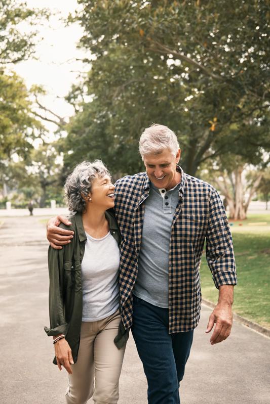 mature couple walking outside near culver city apartments upper ivy