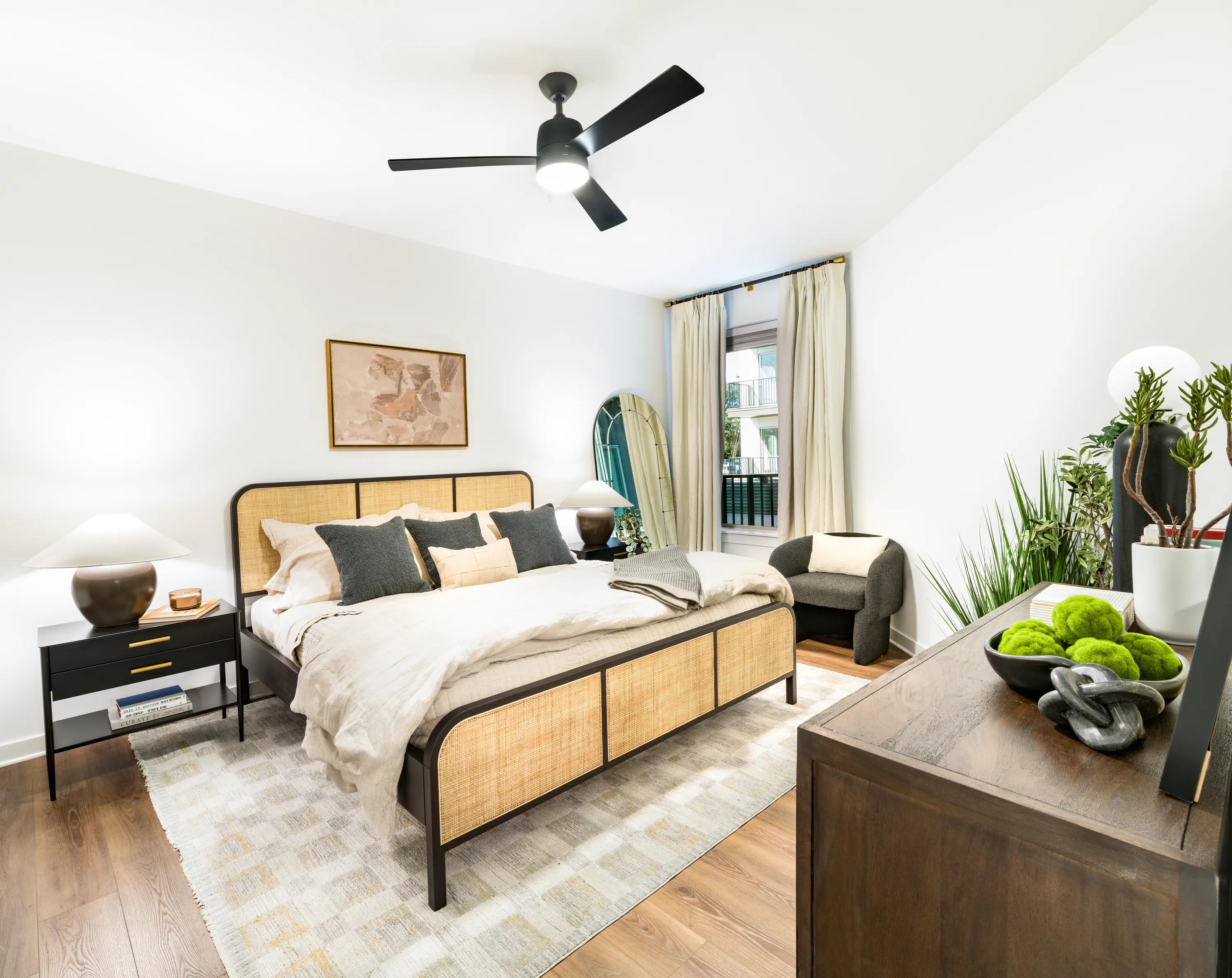 spacious bedroom with large windows and modern furnishings modera nations nashville tn apartments for rent