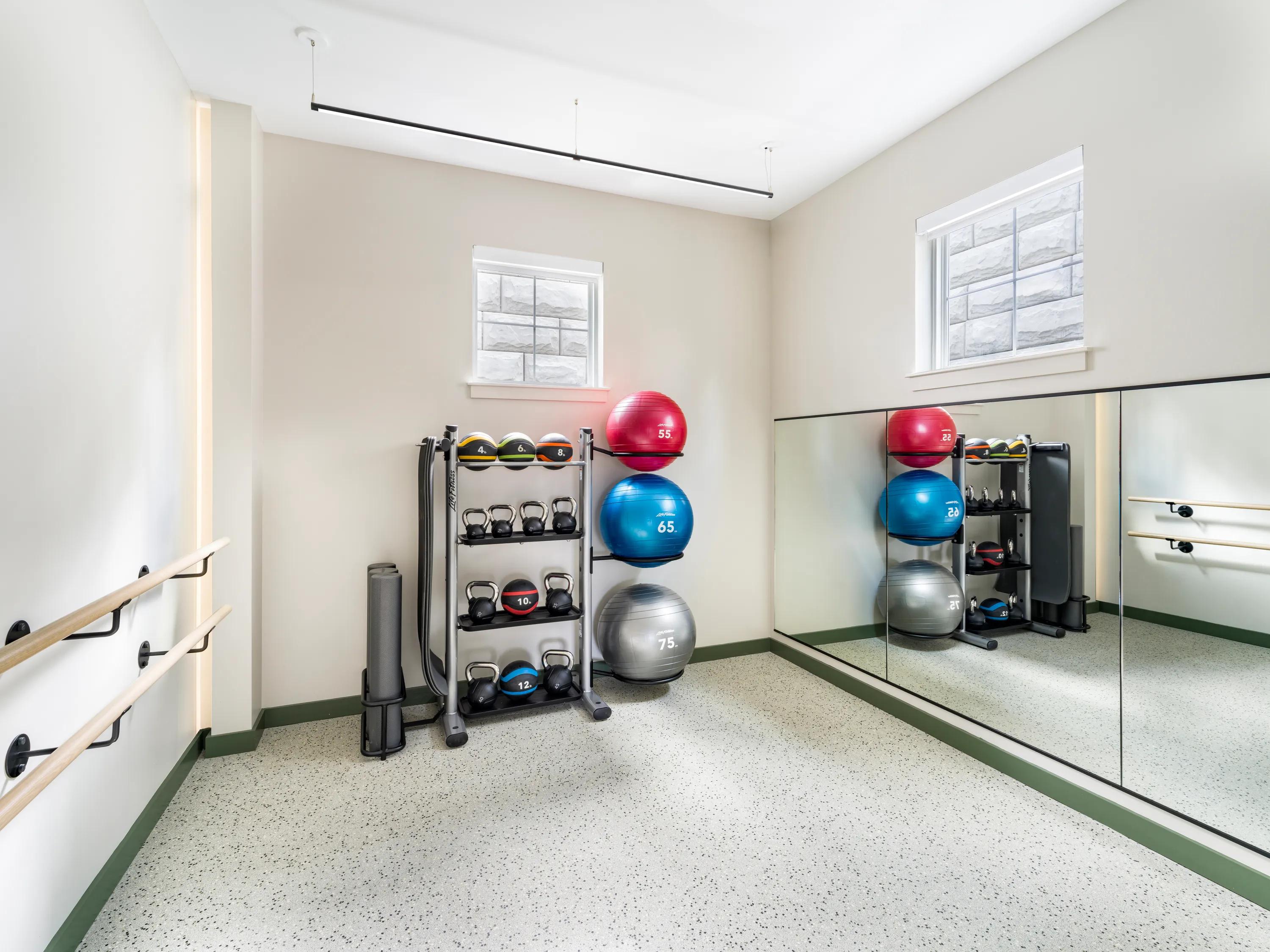 yoga studio with mounted ballet bars and yoga equipment modera south shore apartment homes for rent in marshfield ma