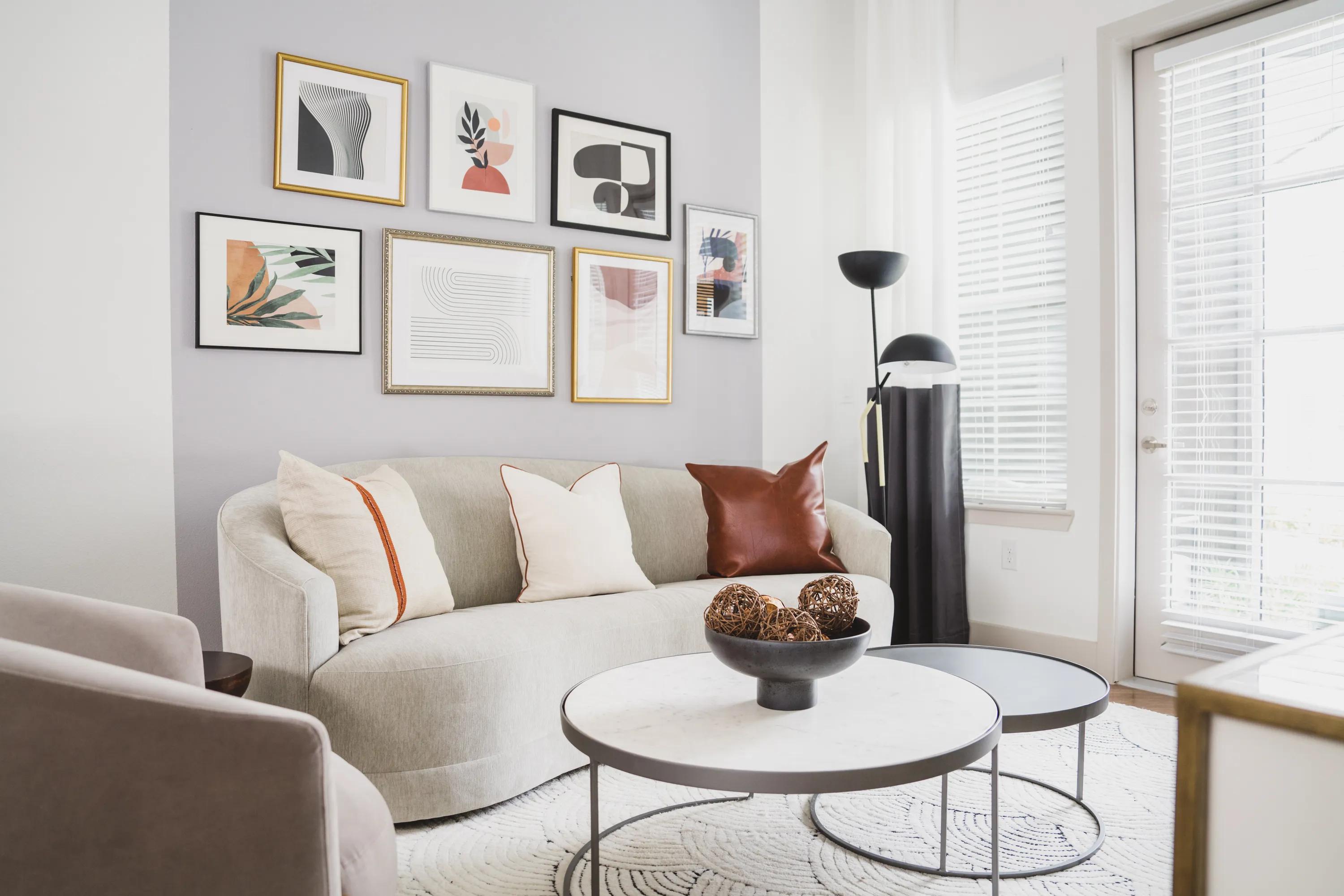 spacious living area with oversized windows and tons of natural light at modera frisco square in frisco tx