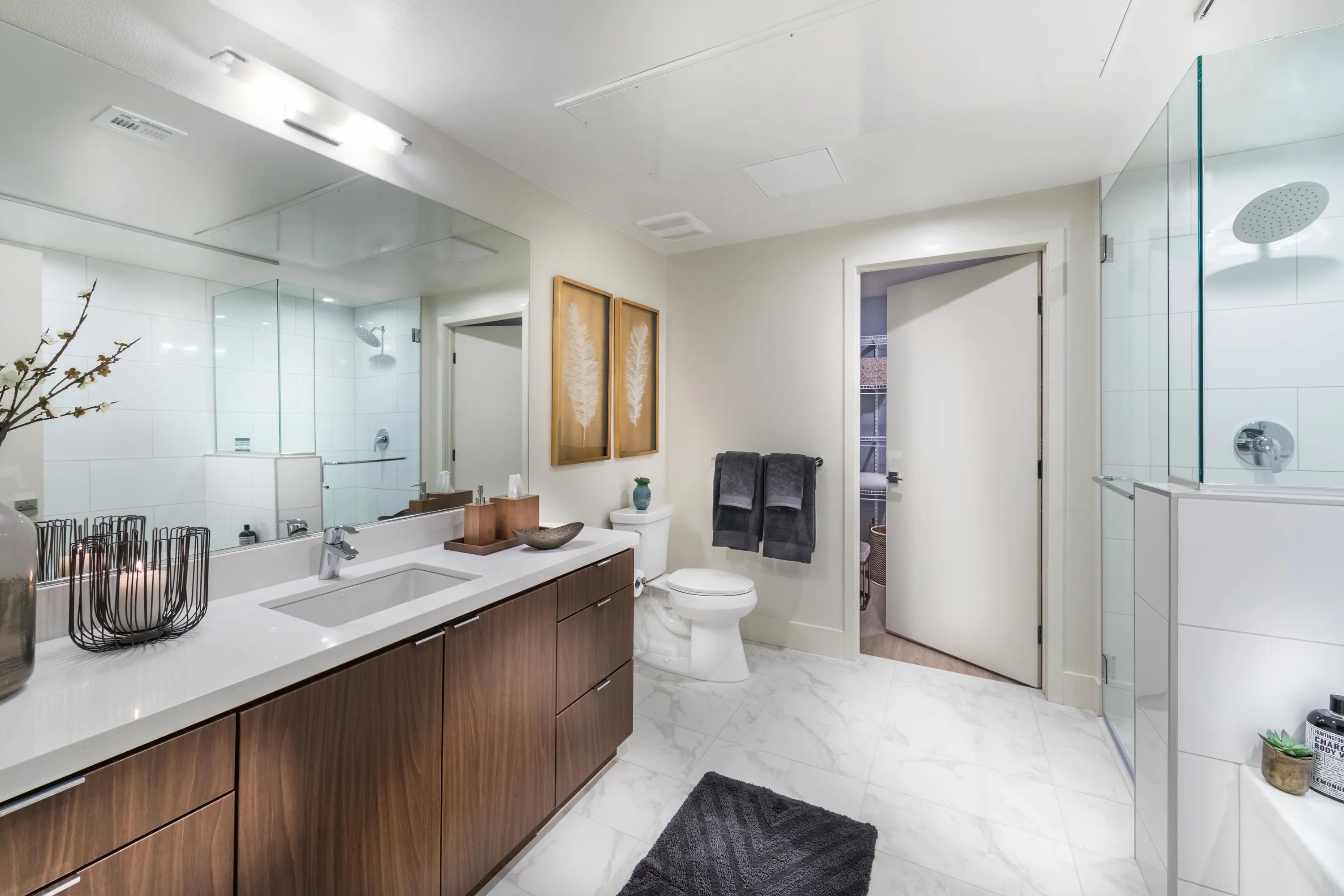 resort inspired bathroom with wood cabinetry 580 anton apartments for rent in costa mesa ca