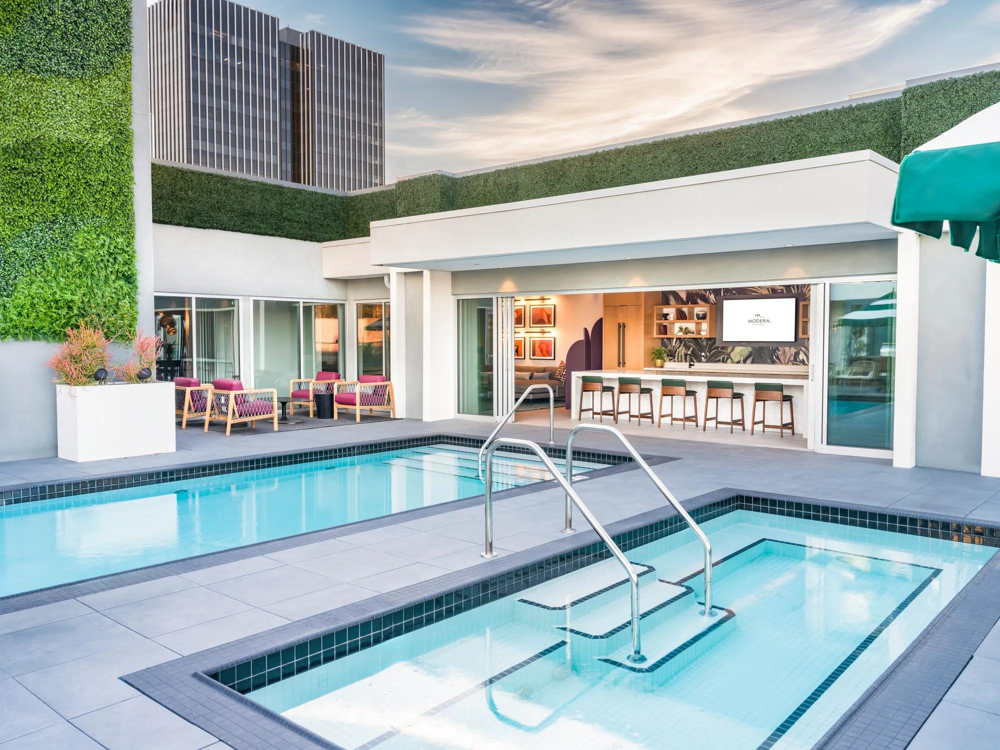 rooftop pool with outdoor bar modera argyle apartments for rent in los angeles ca