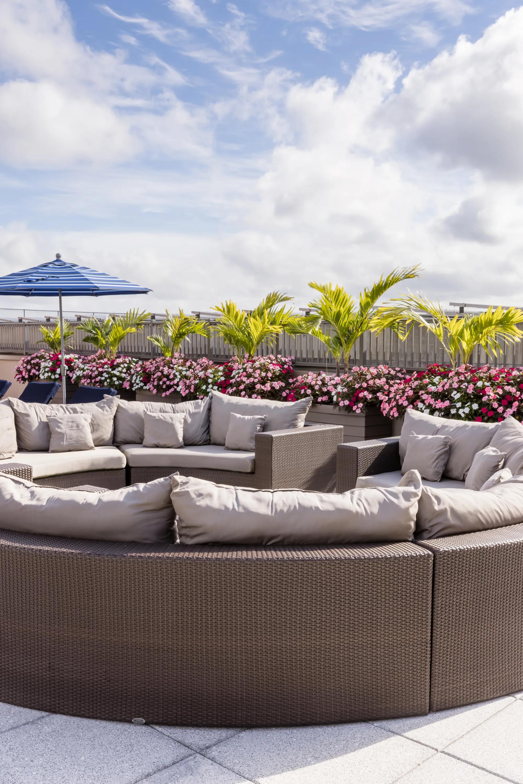 circular outdoor sectional on rooftop metropolitan at 40 park apartment homes for rent in morristown nj