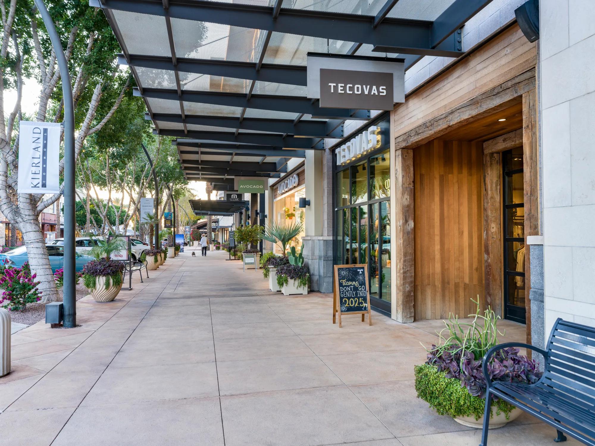 retail space in the late evening and cars parked alongside road modera reserve scottsdale apartment homes for rent in az