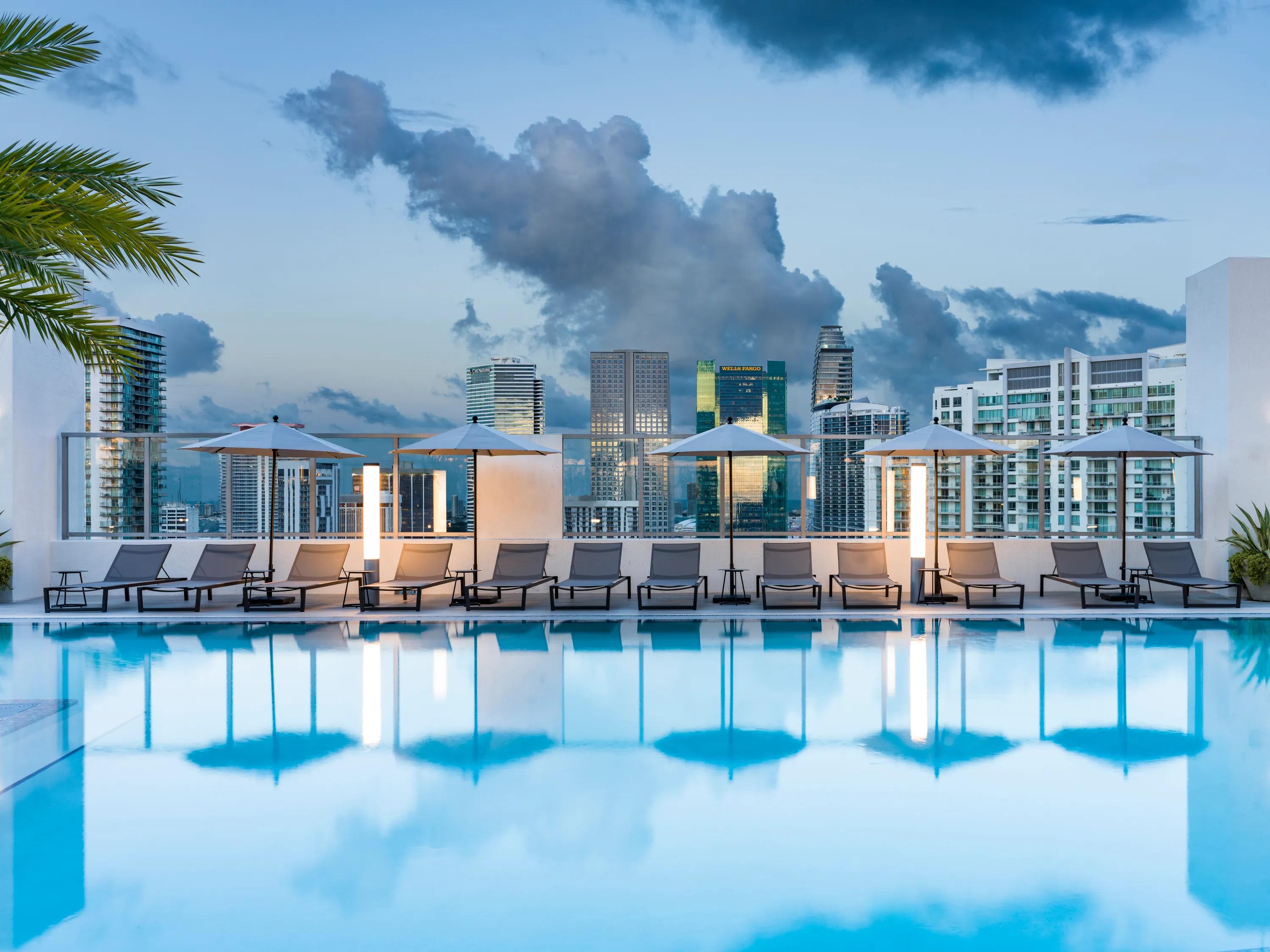 pool chairs surrounding pool modera riverside apartment homes for rent in miami fl