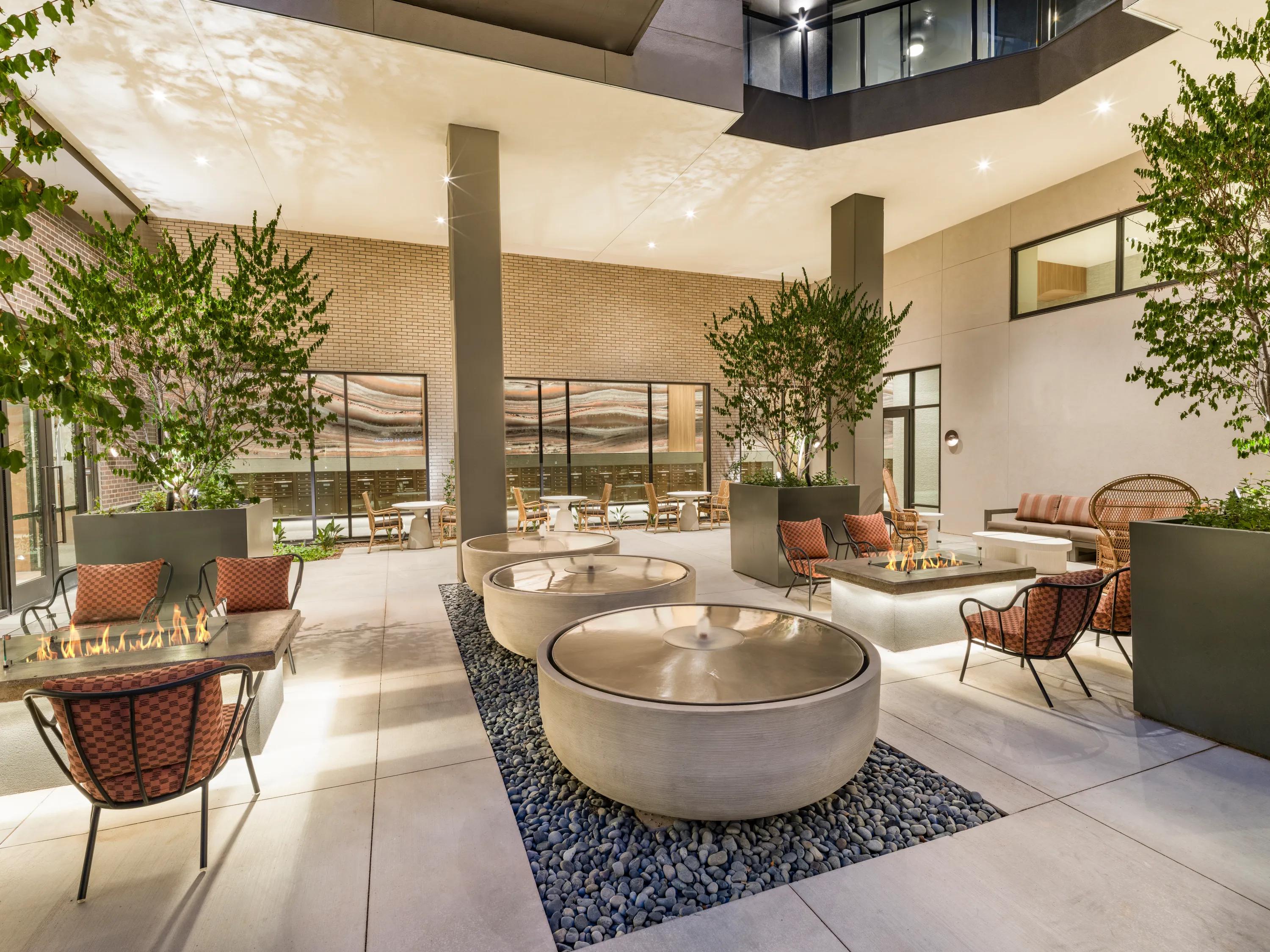 courtyard with fire tables and landscaping modera reserve apartment homes for rent in scottsdale az