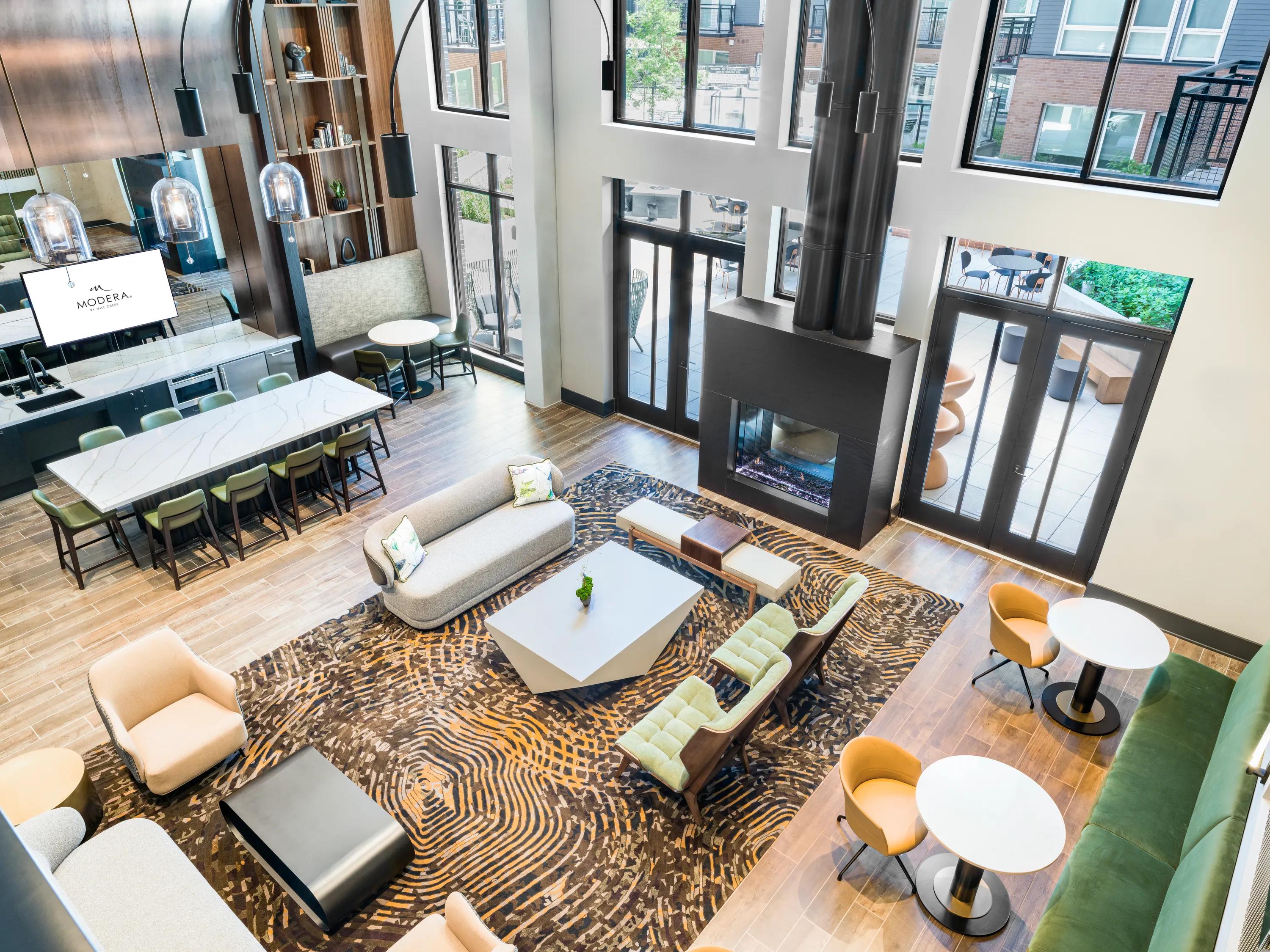 overhead view of the clubroom with bright open windows overlooking the interior courtyard modera h street apartment homes for rent in washington dc