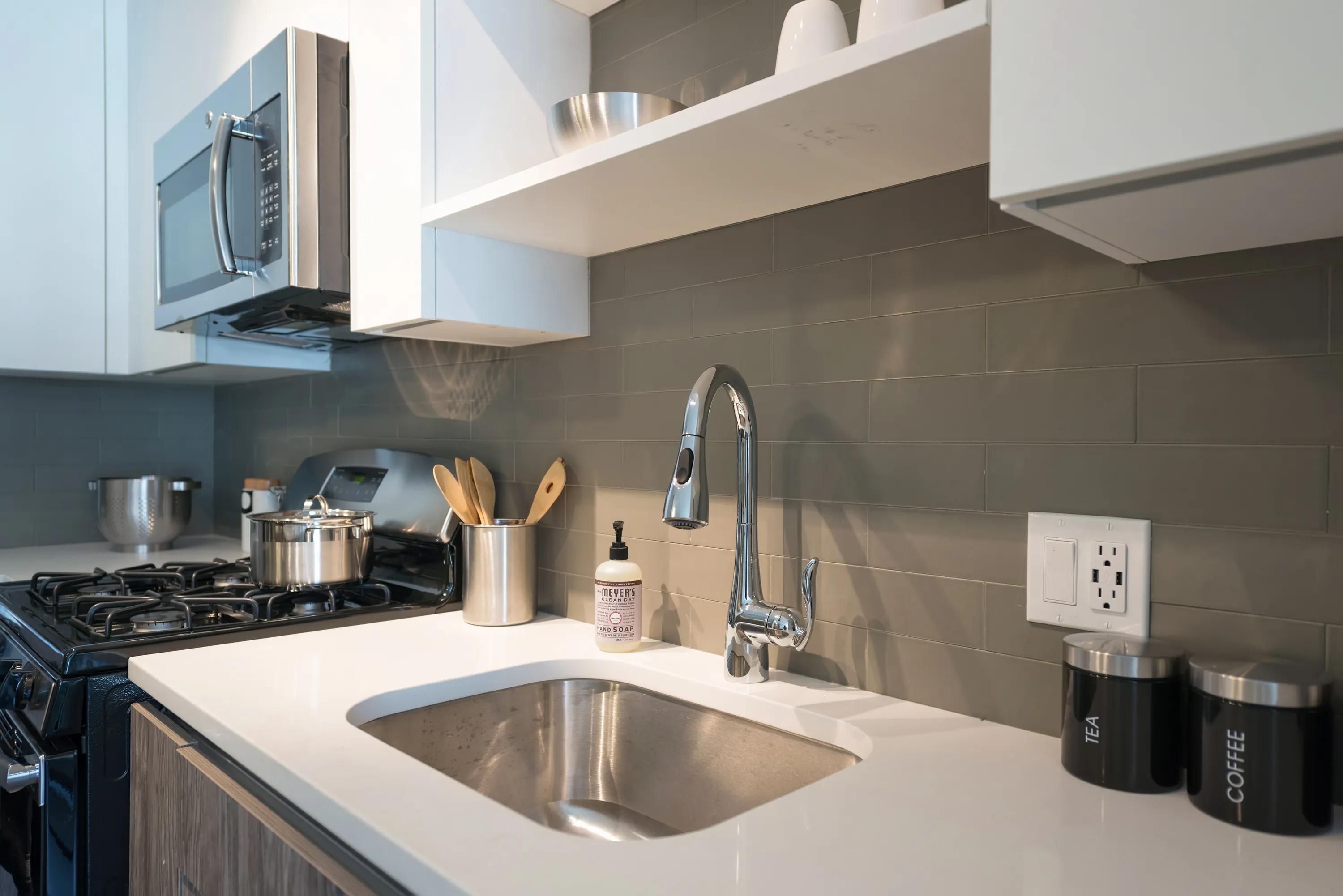 Tile backsplash and quartz countertops