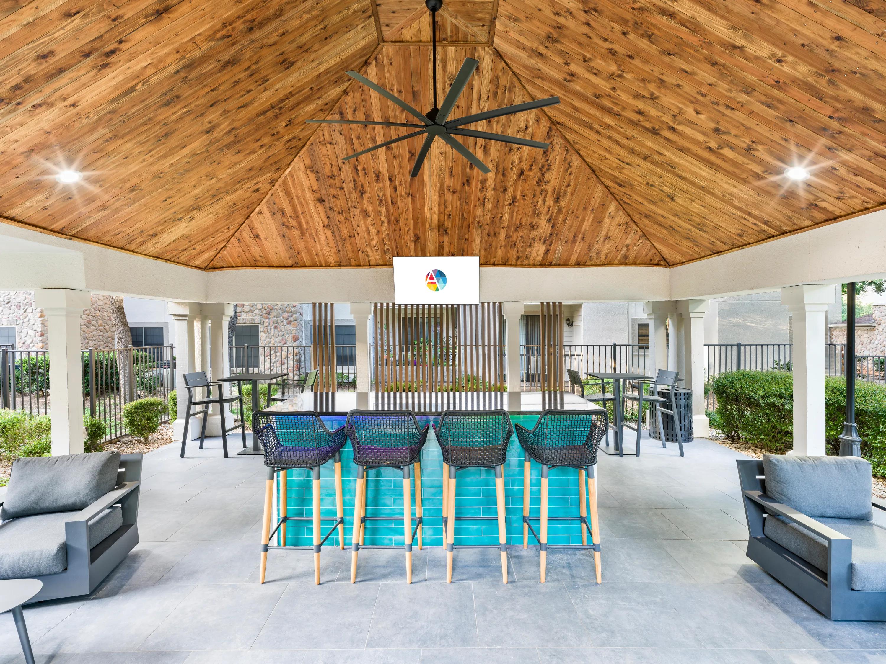 outdoor lounge pavilion with seating dalister sunset valley apartment homes for rent in austin tx