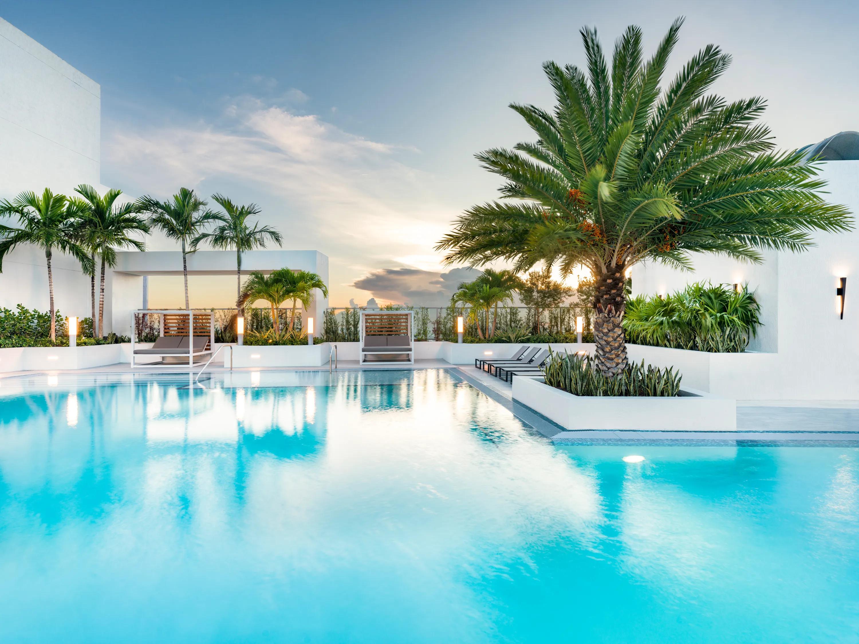 swimming pool with lounge chairs and social deck modera riverside apartment homes for rent in miami fl