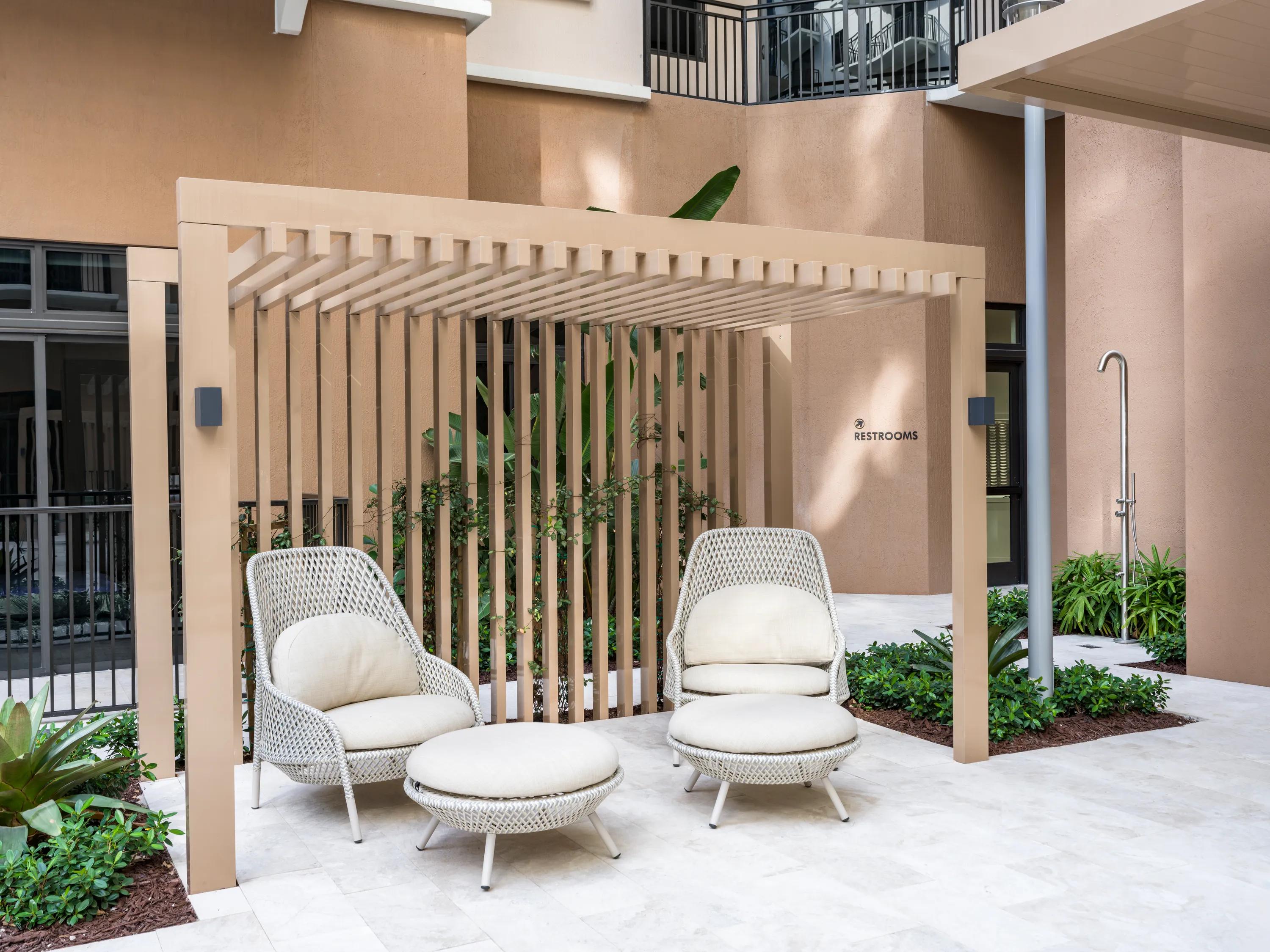 covered outdoor seating with leg rest modera academical village apartment homes for rent in davie fl