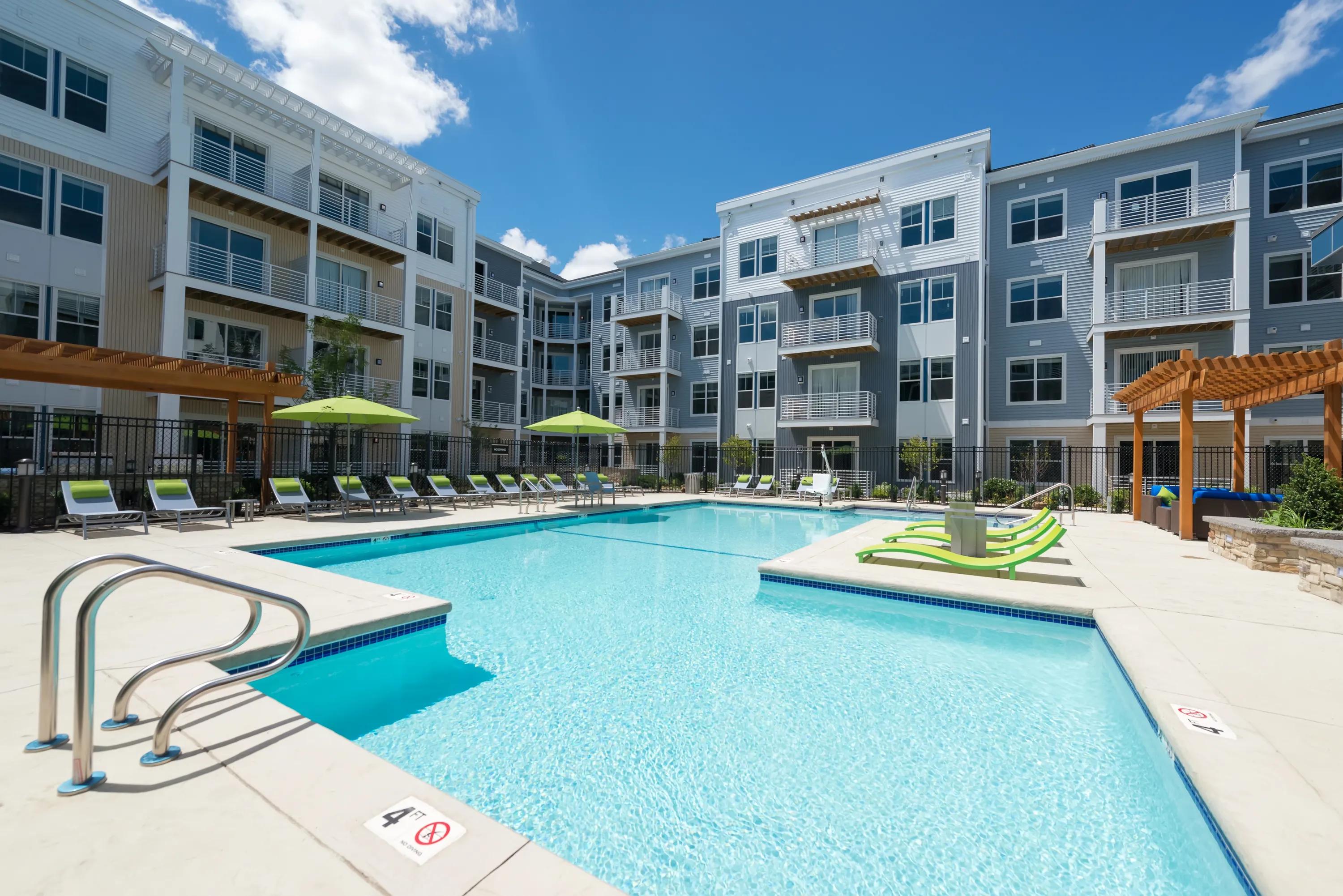 Outdoor pool area with loungers