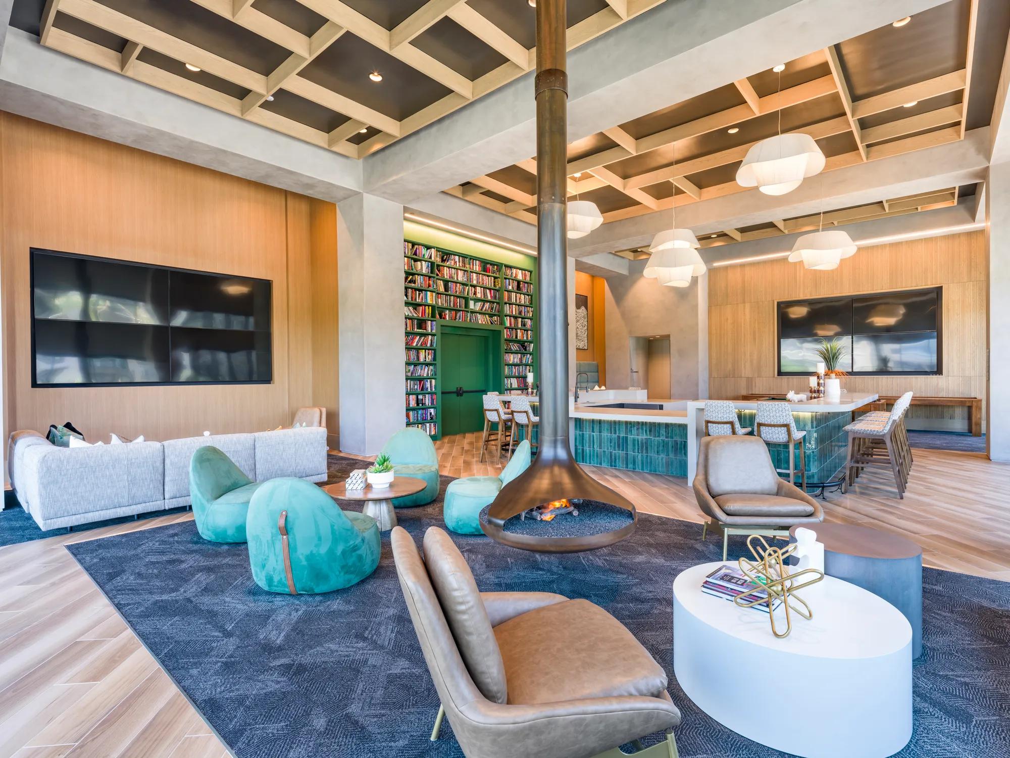 clubroom with billiards table and bookshelves modera scottsdale apartment homes for rent in az