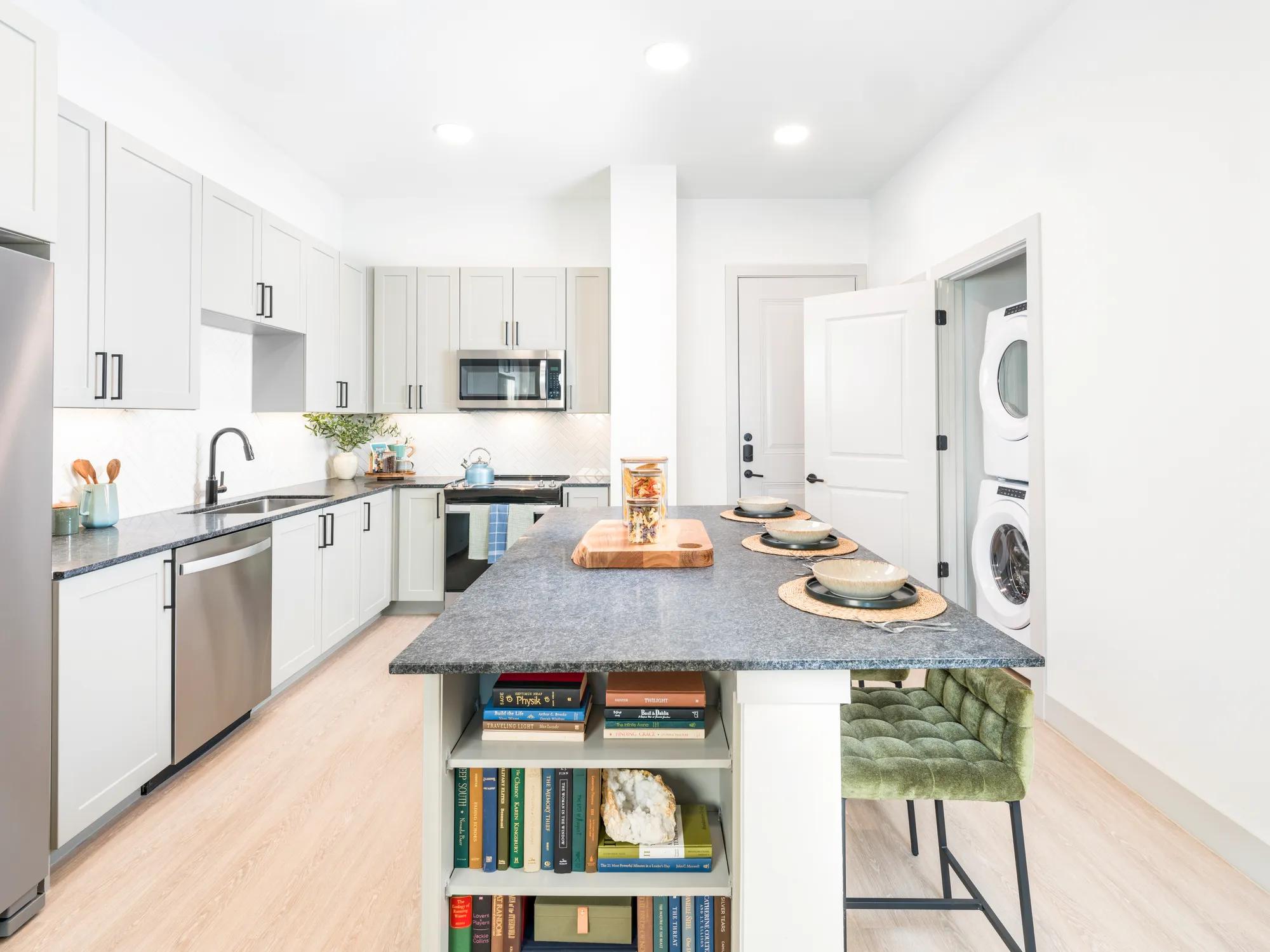 large kitchen with island and built in shelving stainless steel appliances modera mckinney ridge apartment homes for rent in tx